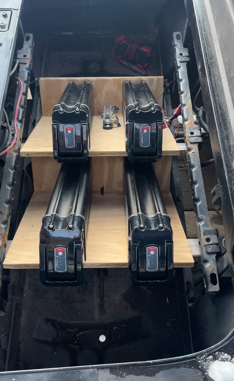 Prototype batteries mounted in a golf cart under the seat